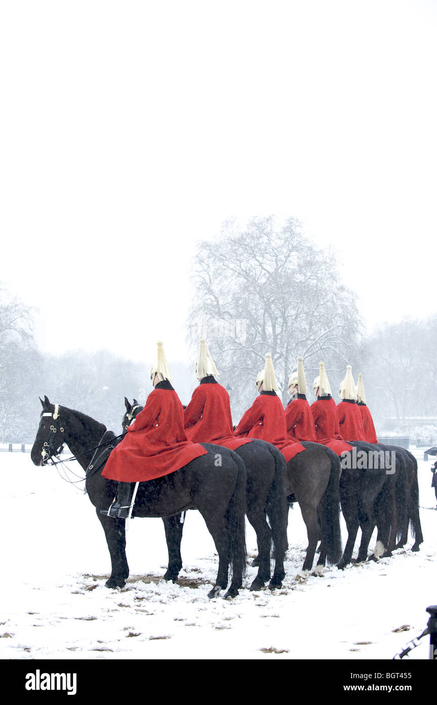 The Queen's Life Guards on horses in the snow, London, England Stock Photo