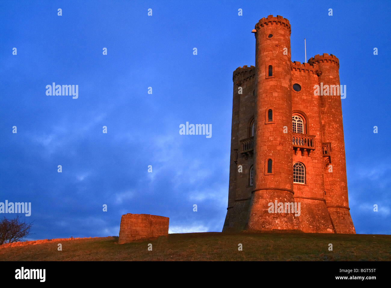 Broadway Tower at sunset near Broadway, Cotswolds, England taken in the evening golden light Stock Photo