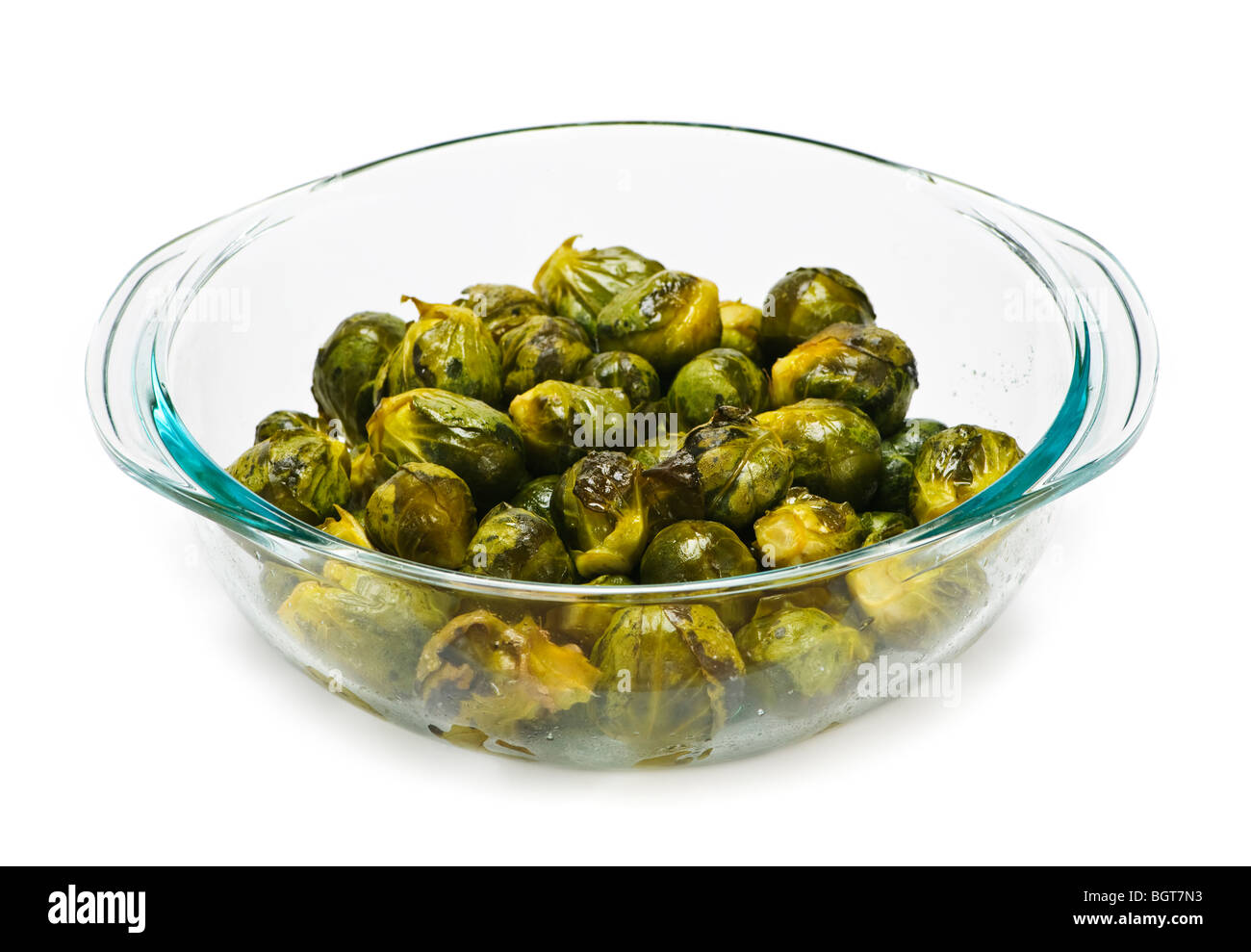 Casserole dish of roasted cooked green brussels sprouts Stock Photo