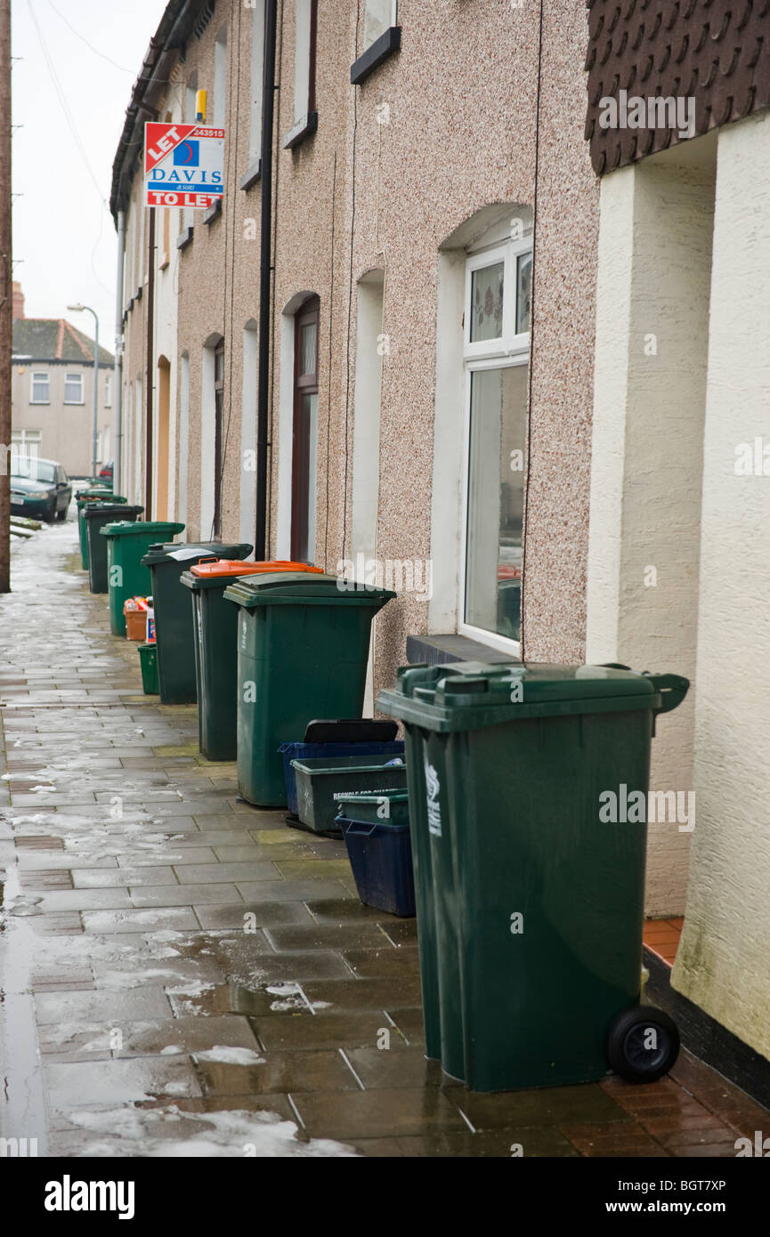 Wheelie bins on pavement outside terraced houses in Newport South Wales UK Stock Photo Alamy