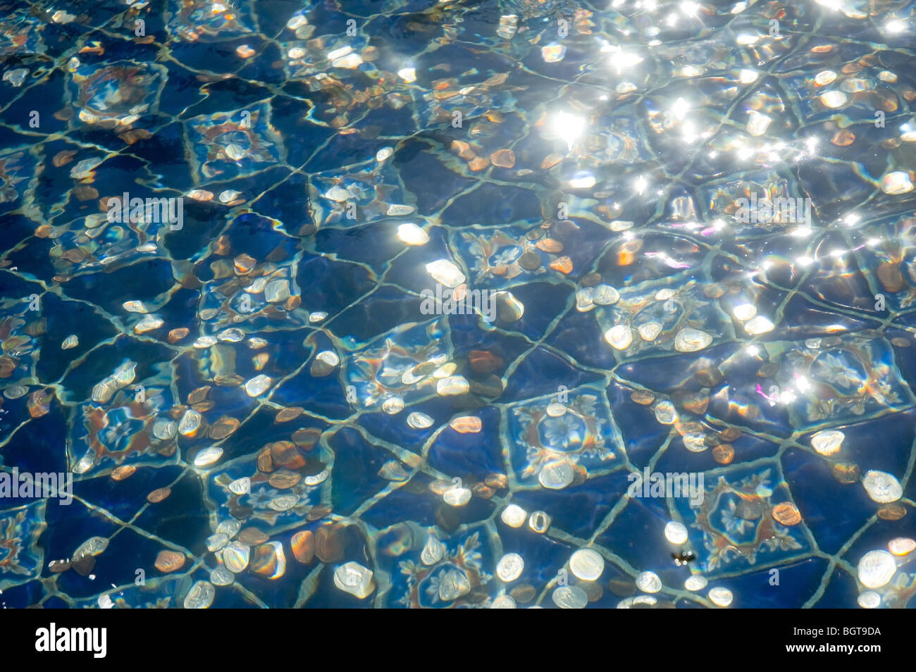 Coins in fountain at Carmel Mission, California Stock Photo Alamy