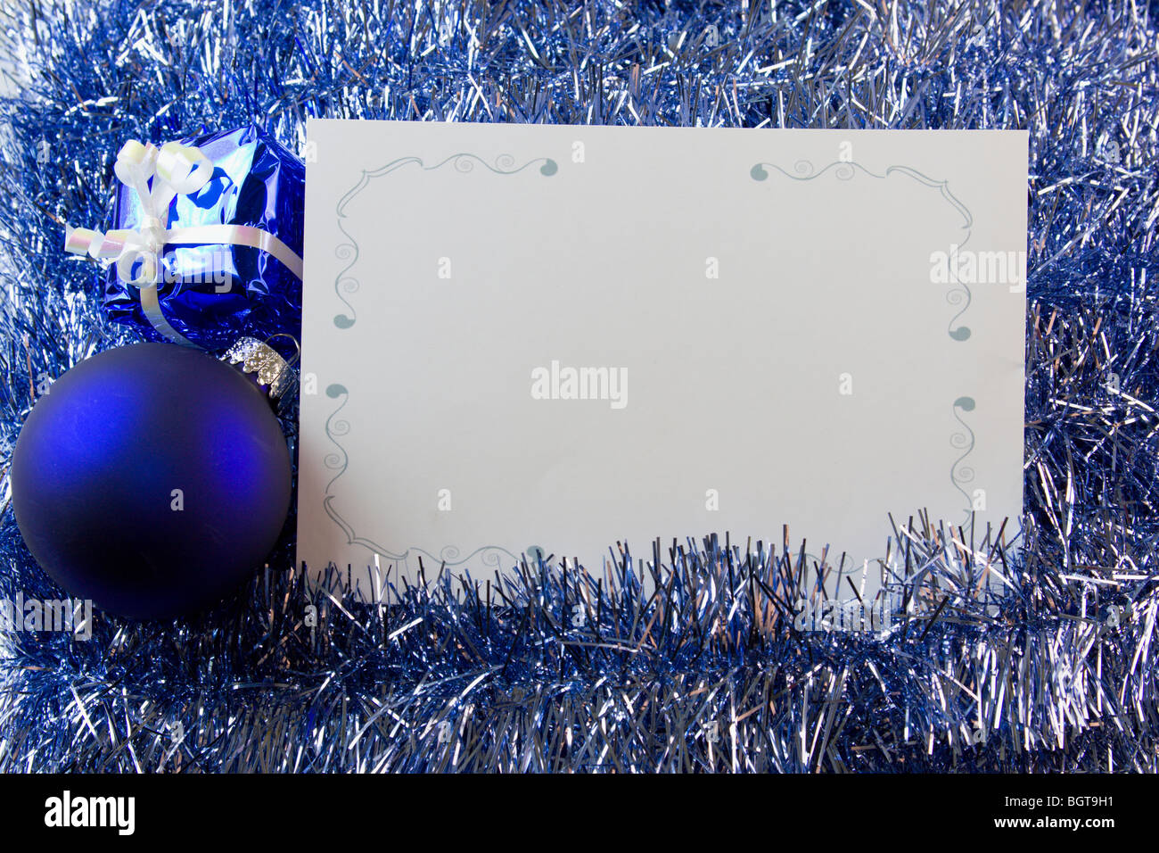 blank Christmas greeting card with blue ornaments and copyspace Stock Photo