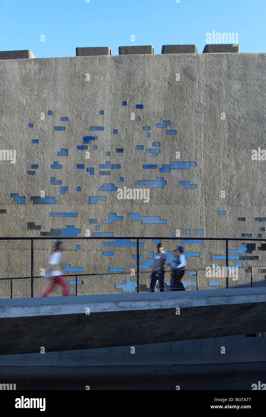 tea tenerife espacio de las artes, view of people with the feature concrete wall as a backdrop Stock Photo