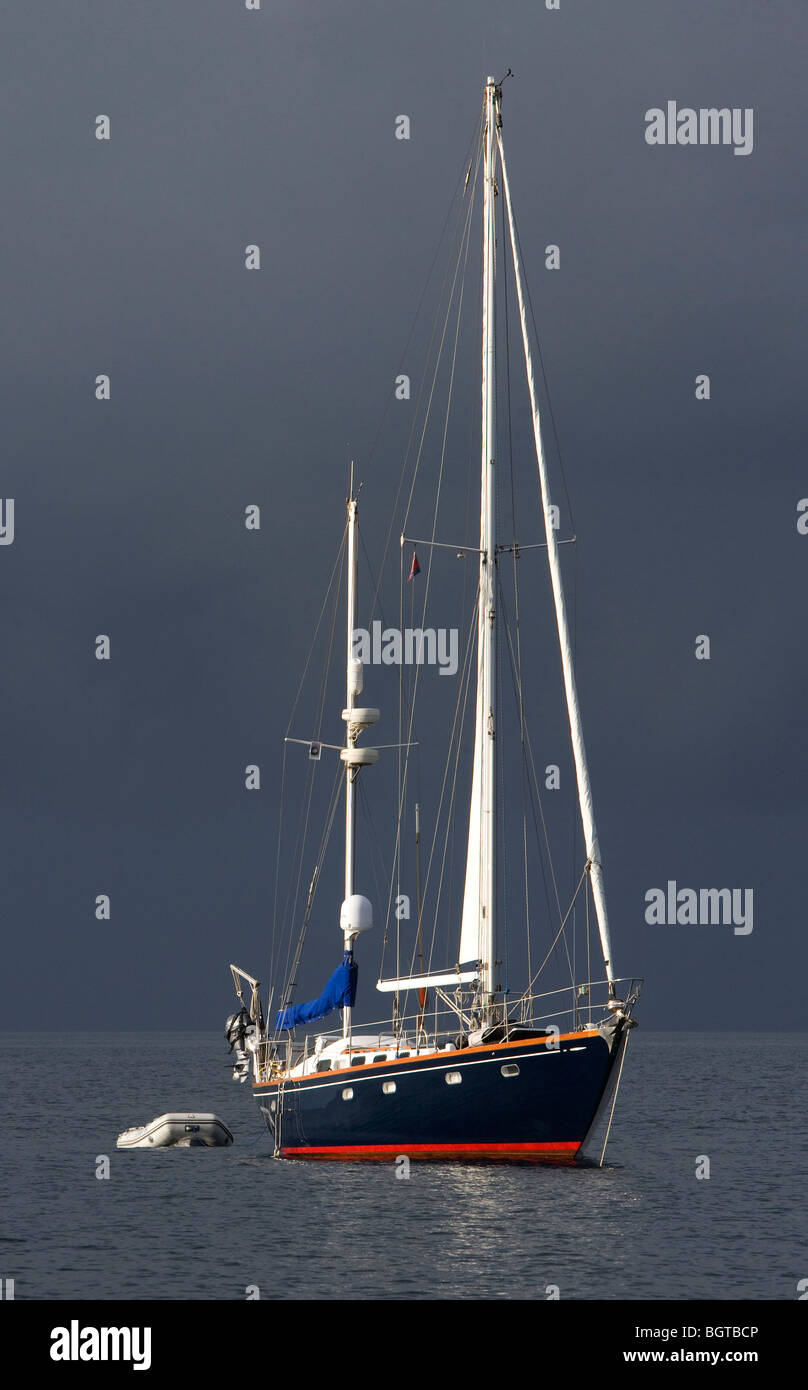 Sailboat anchored at sea Stock Photo
