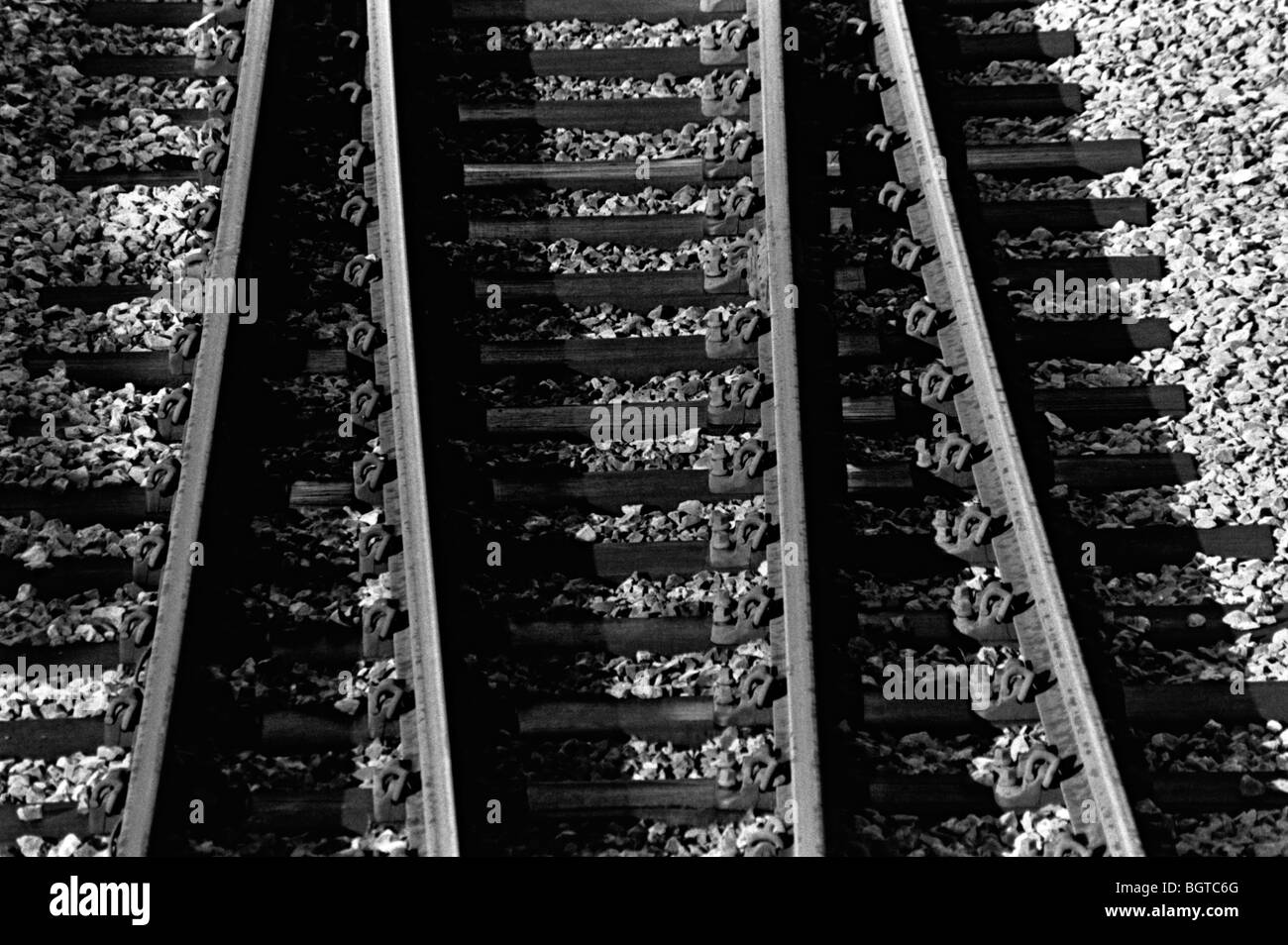 abstract shot of train tracks in black and white shot from above of some points Stock Photo