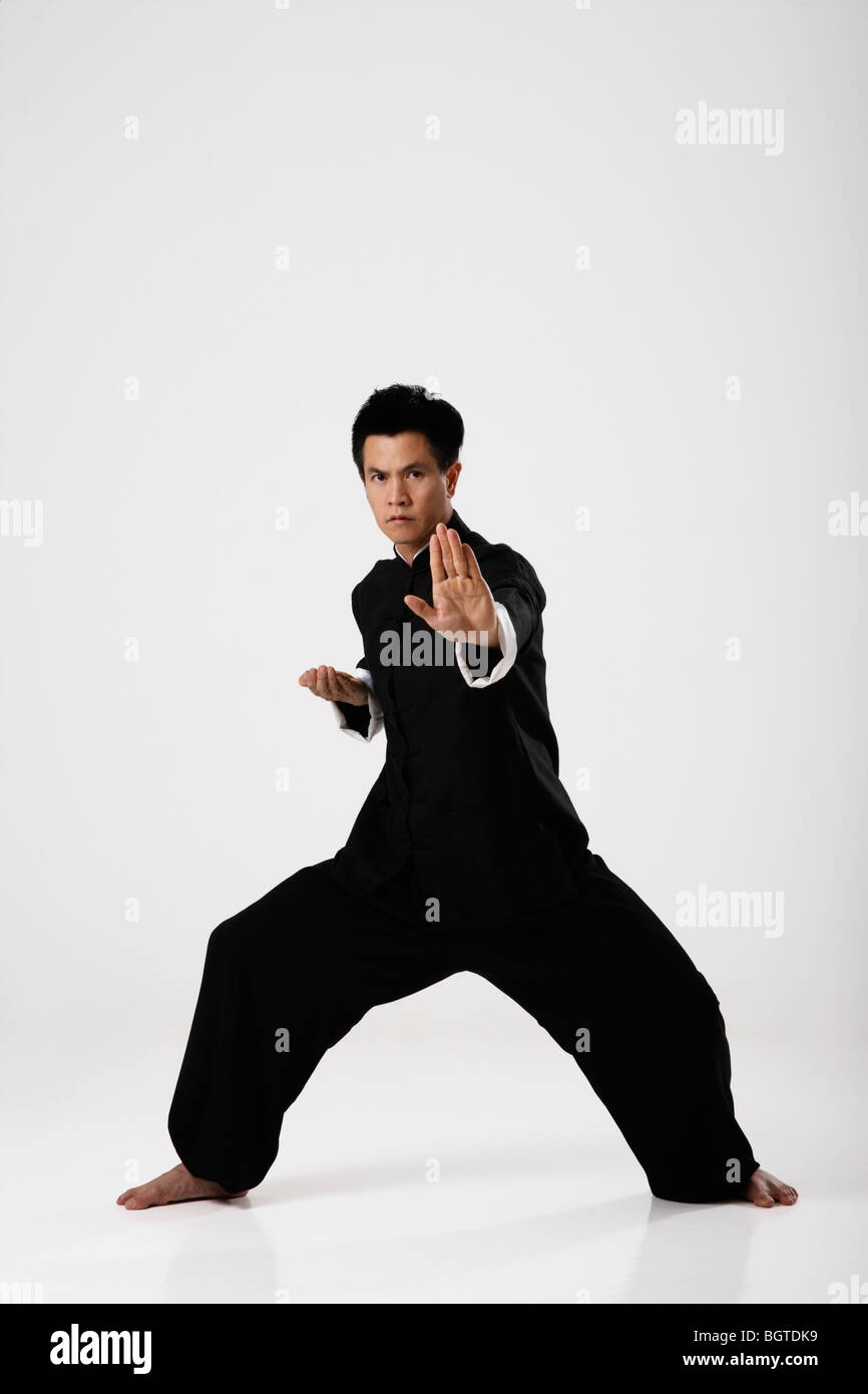 Man doing martial arts wearing traditional Chinese clothes Stock Photo