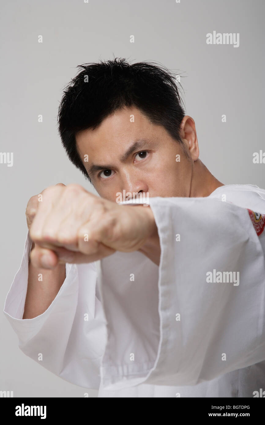 Head shot of Chinese man punching, martial arts Stock Photo Alamy