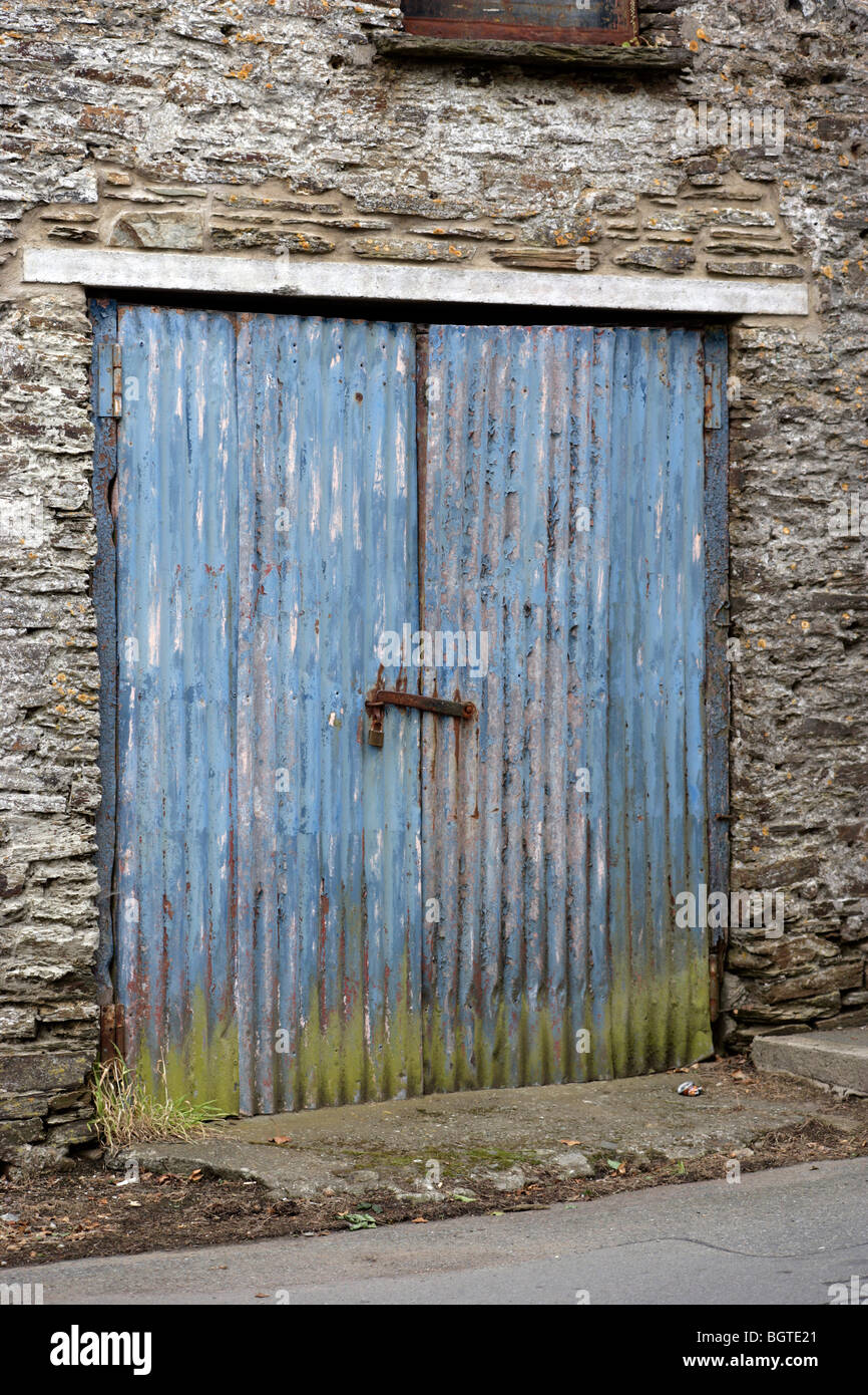 Blue corrugated iron doors to a garage. Stock Photo