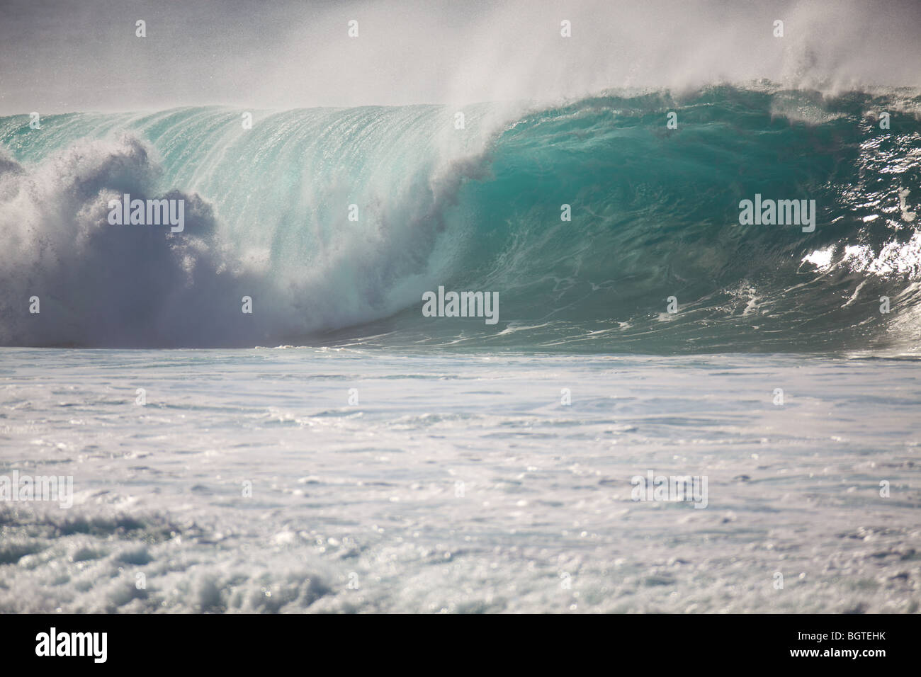 A large wave breaks at Waimea Bay, North Shore, Oahu, Hawaii Stock