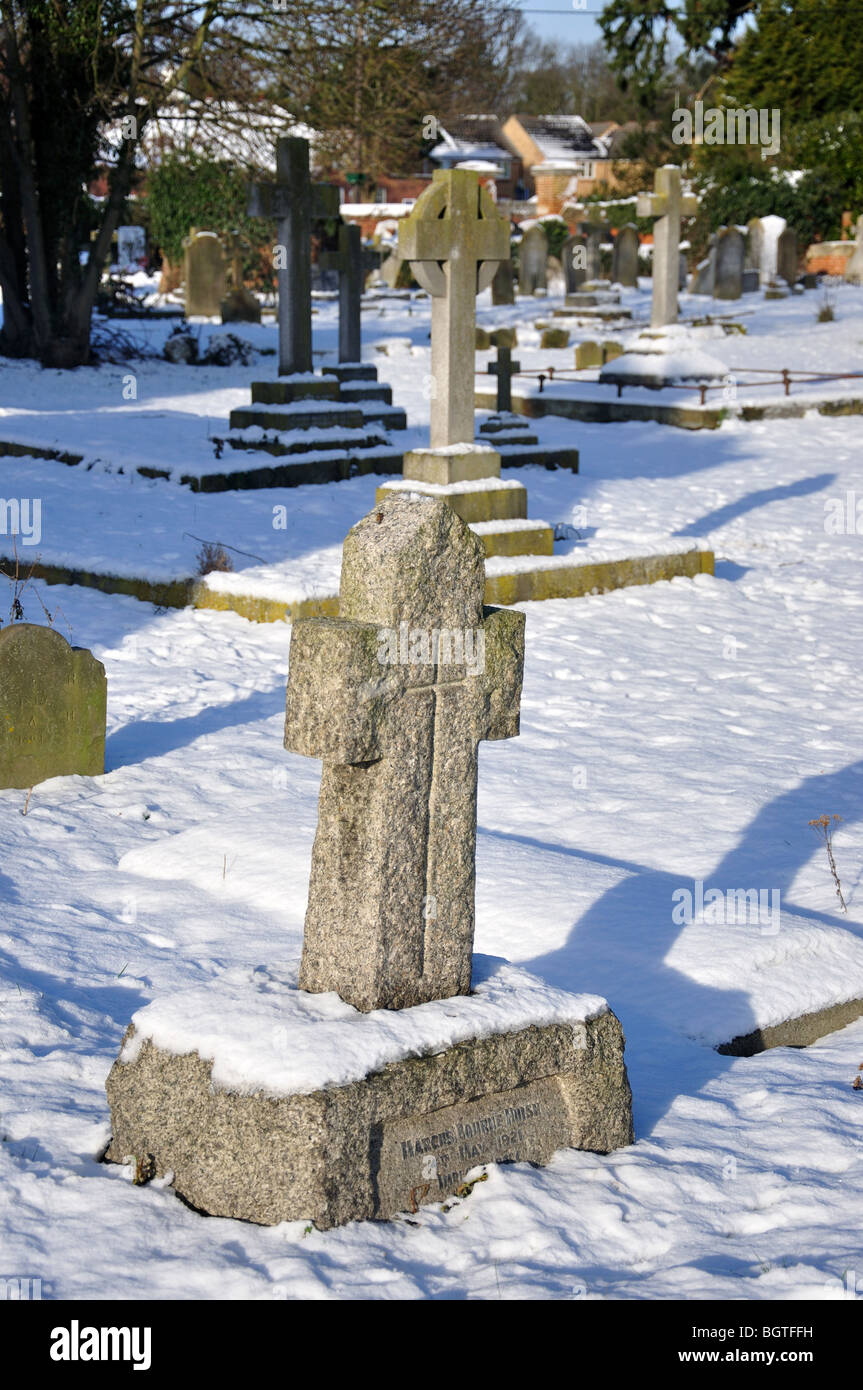 Graveyards in snow, St Michael's Church, Horton, Berkshire, England, United Kingdom Stock Photo