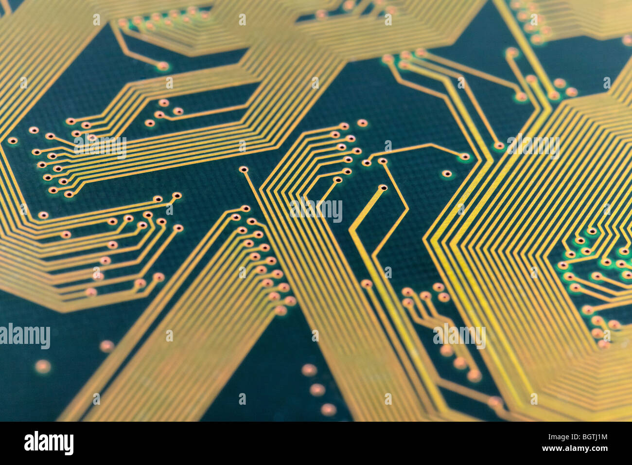 Green old circuit board with golden paths Stock Photo