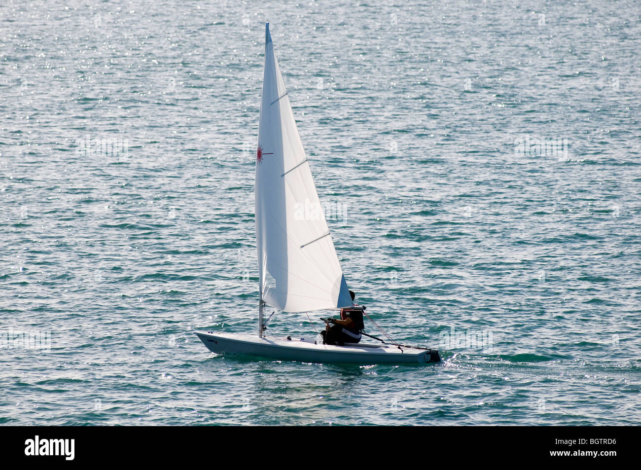 sailing boat boats yacht boating sail sailing sails wind in your sea competition one man dingy  Dingyi's Stock Photo