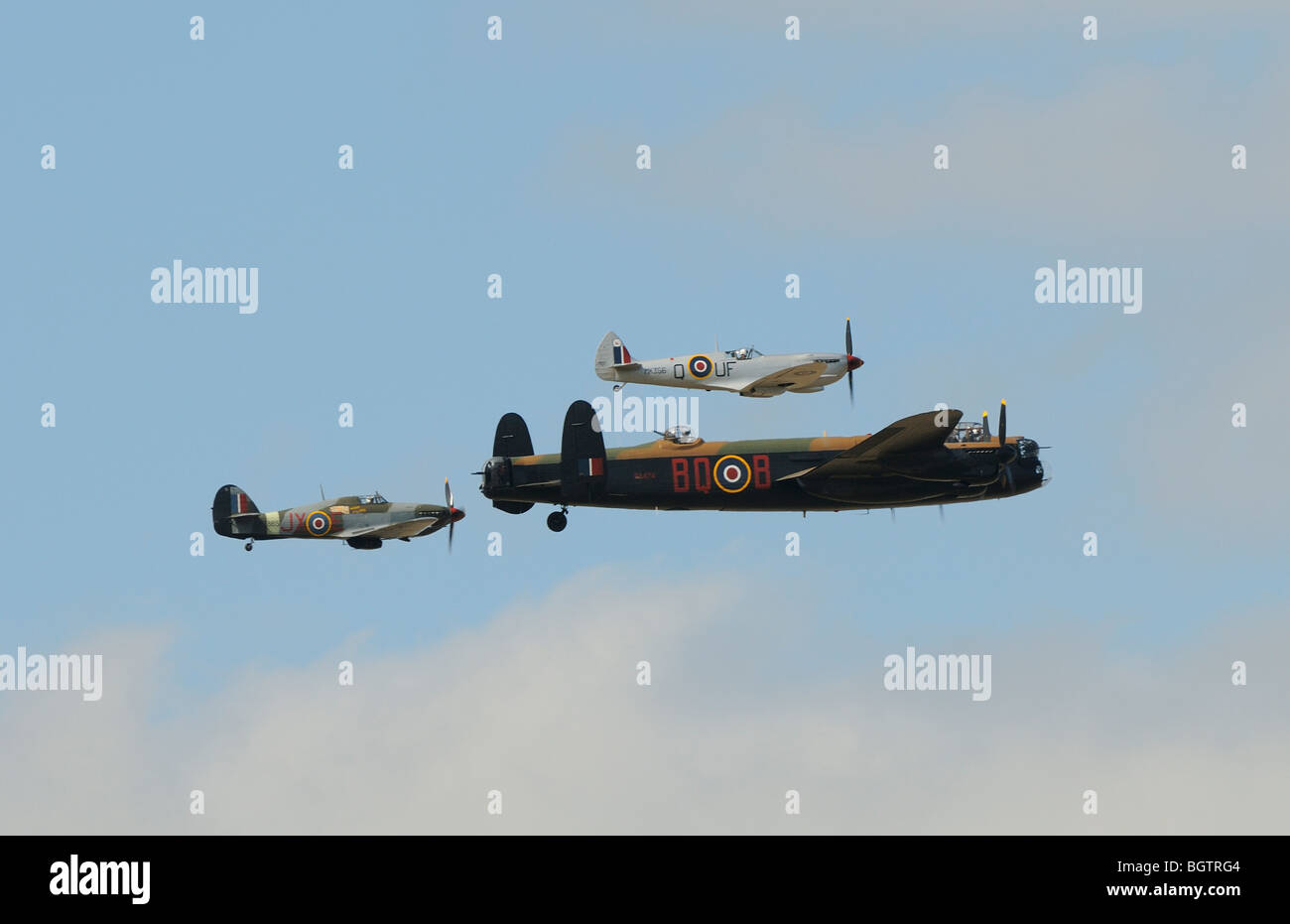 Battle of Britain memorial flight, Lancaster Spitfire and Hurricane aircraft in formation over Oxfordshire, UK. Stock Photo