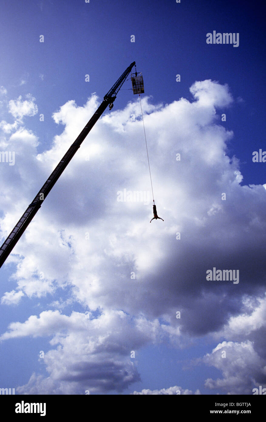 Bungee jumper hanging from a crane Stock Photo Alamy