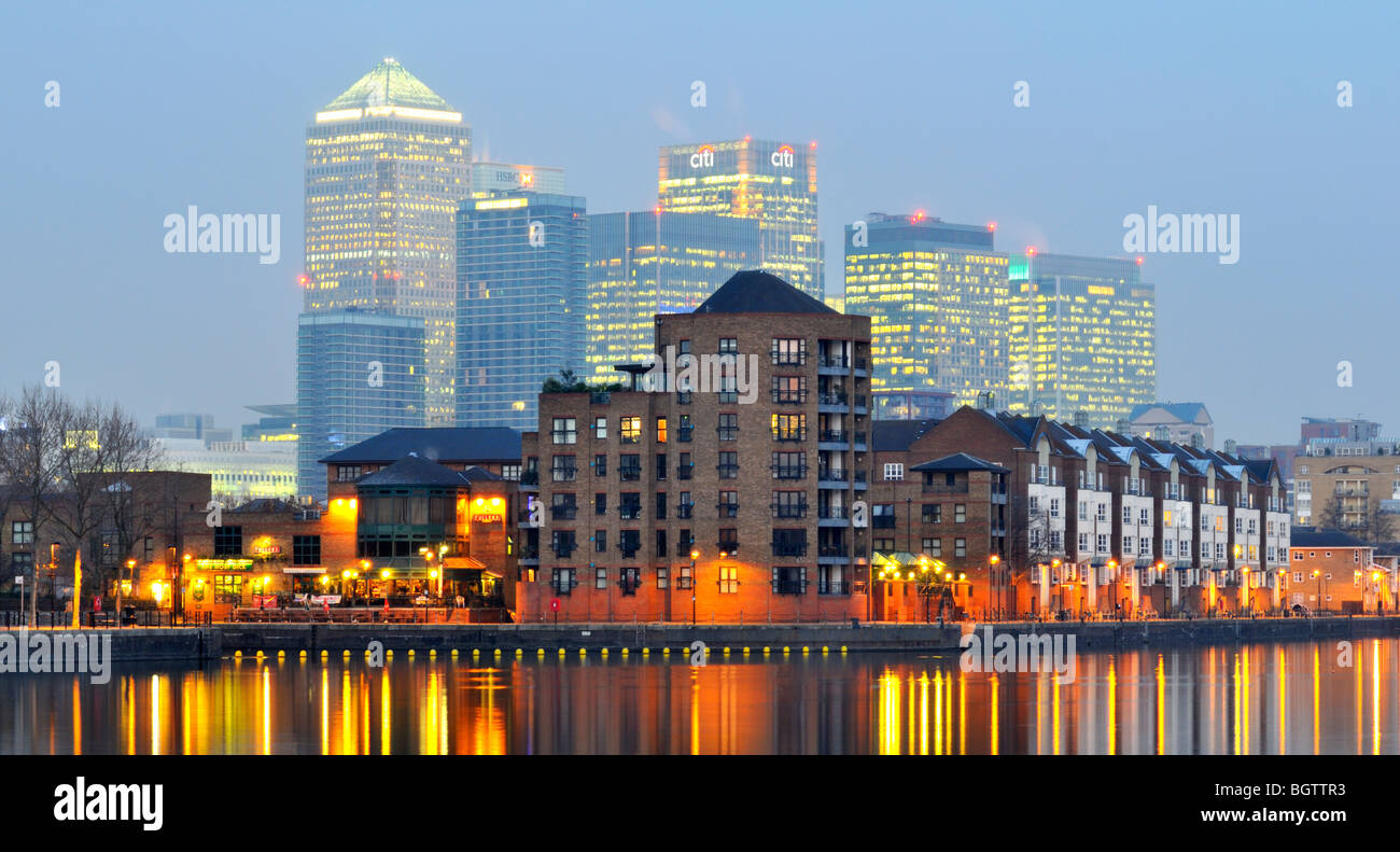 Night view of Greenland Dock with Canary Wharf in the background, Surrey Quays, Rotherhithe, East London, SE16, United Kingdom Stock Photo