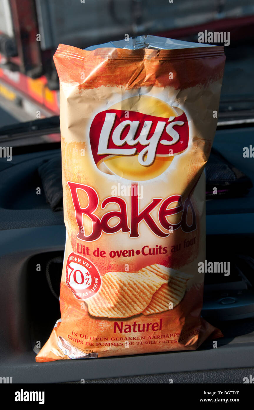 Lays baked crisps packet on dashboard of van Stock Photo