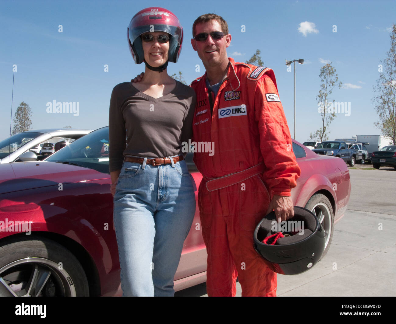 Female driver and race car driving instructor at Buttonwillow race