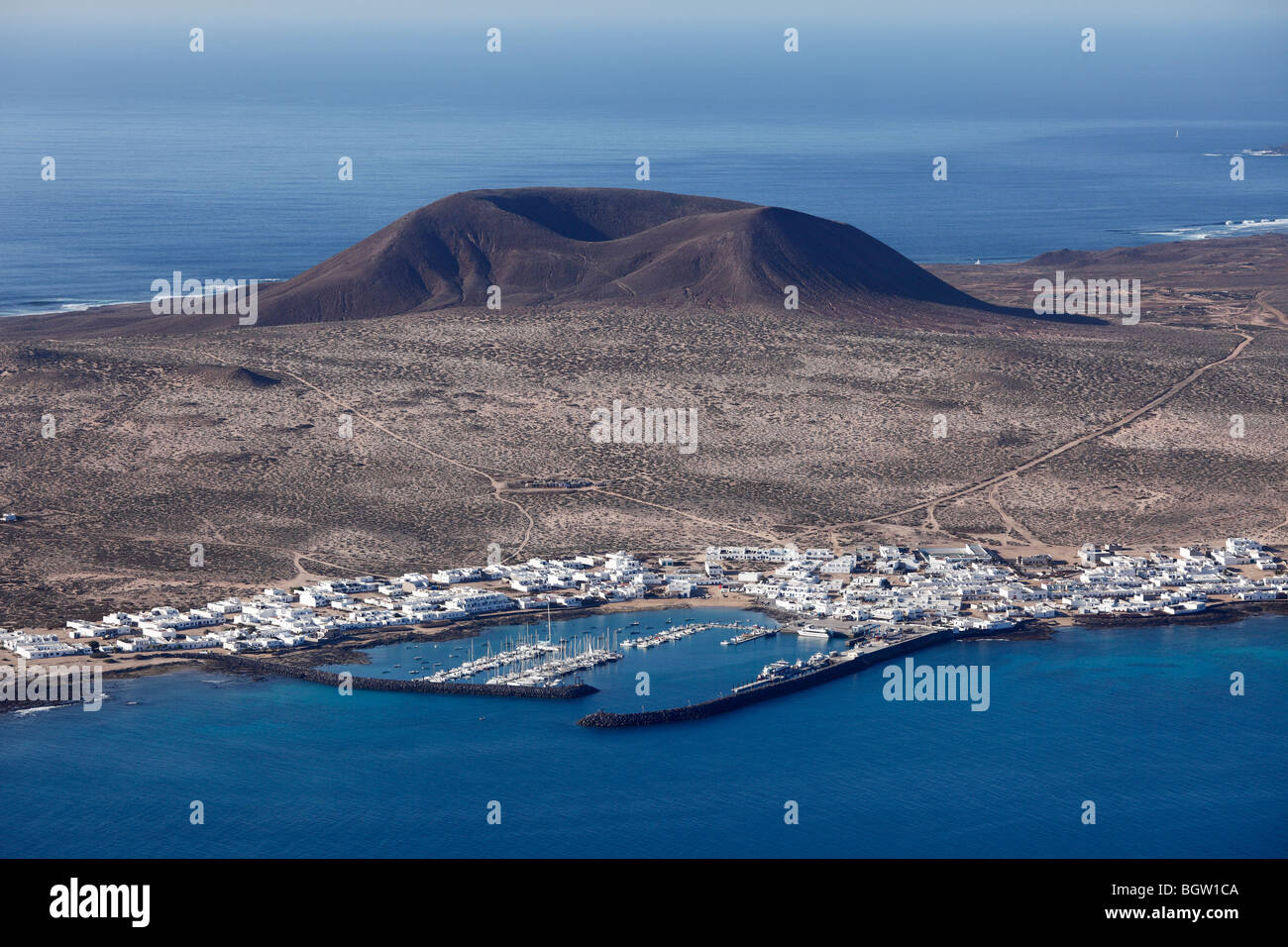 La Graciosa Island with the town of Caleta del Sebo and Montaña del Mojon mountain, view from Lanzarote, Canary Islands, Spain, Stock Photo