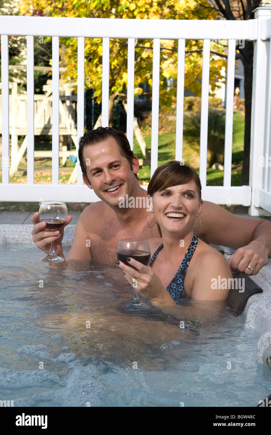 Young married couple in hot tub Stock Photo photo