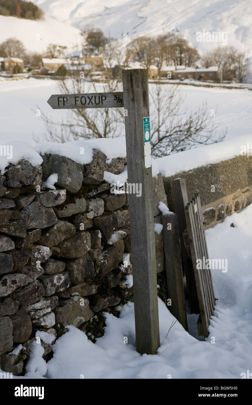 Wooden sign post way marker showing route of footpath to Foxup in the Yorkshire Dales National Park, Littondale, UK Stock Photo