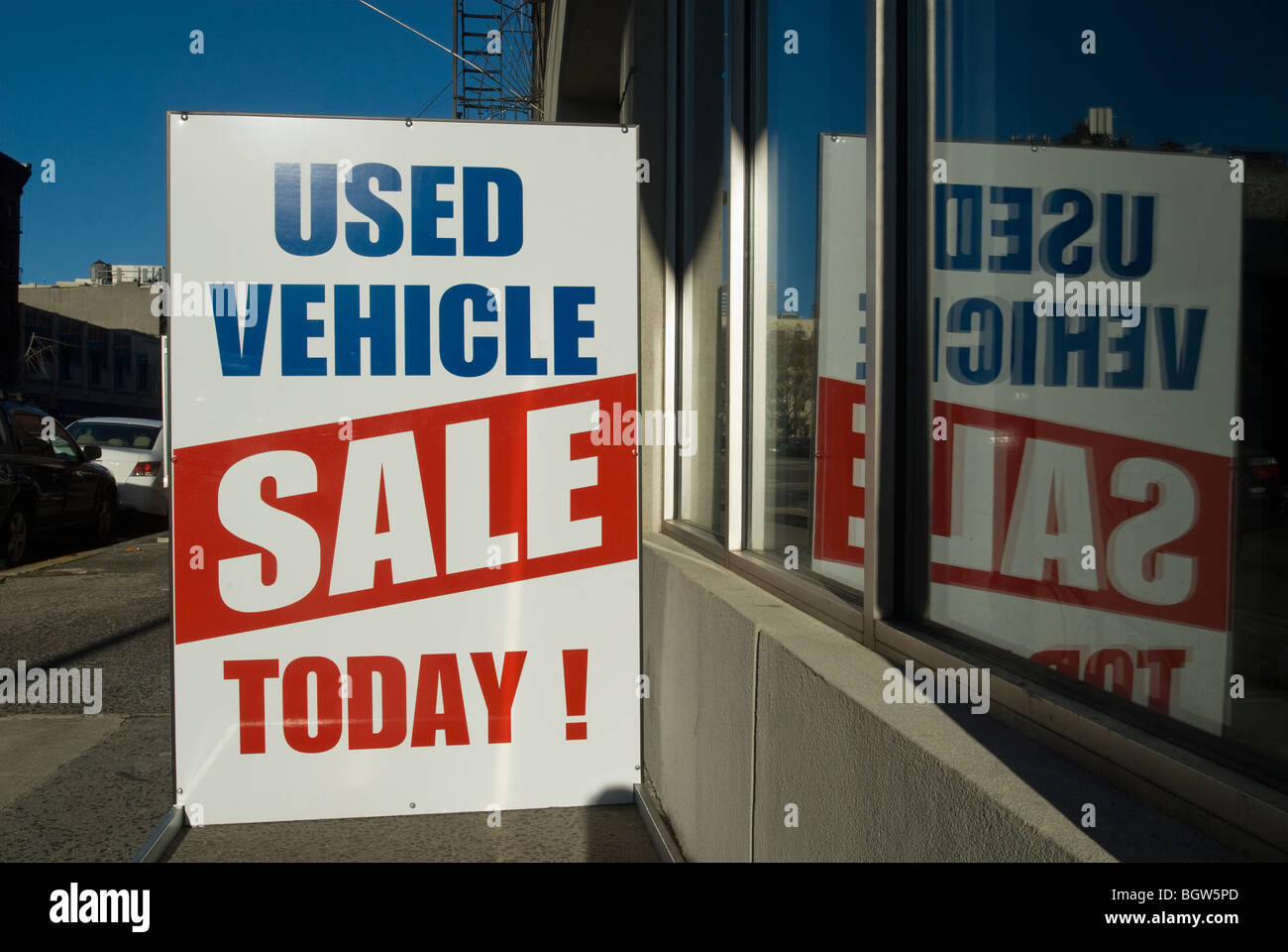 A used car dealer advertises their sale in New York Stock Photo Alamy