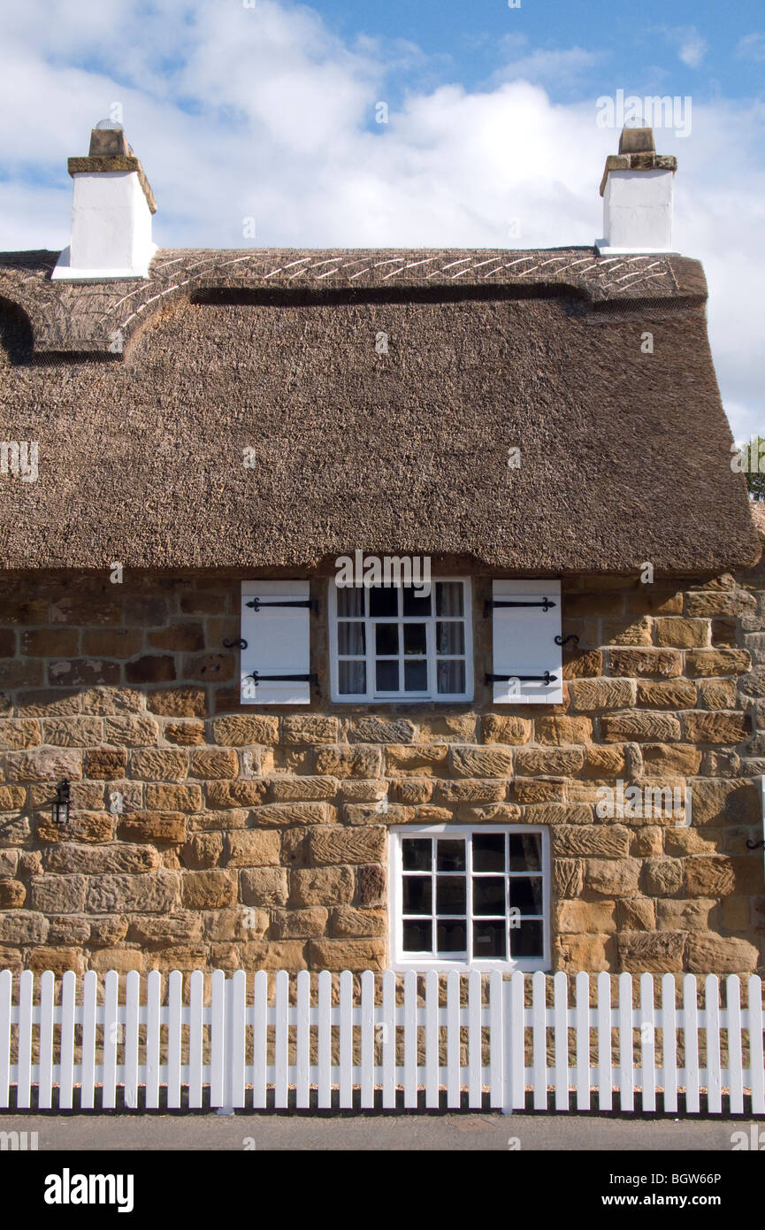 Exterior Of A Typical Stone Built Coastal Cottage In The Village