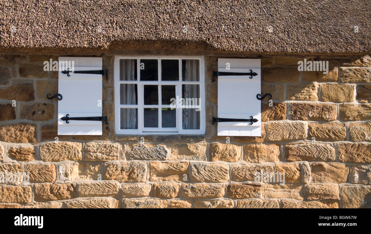 Exterior Of A Typical Stone Built Coastal Cottage In The Village