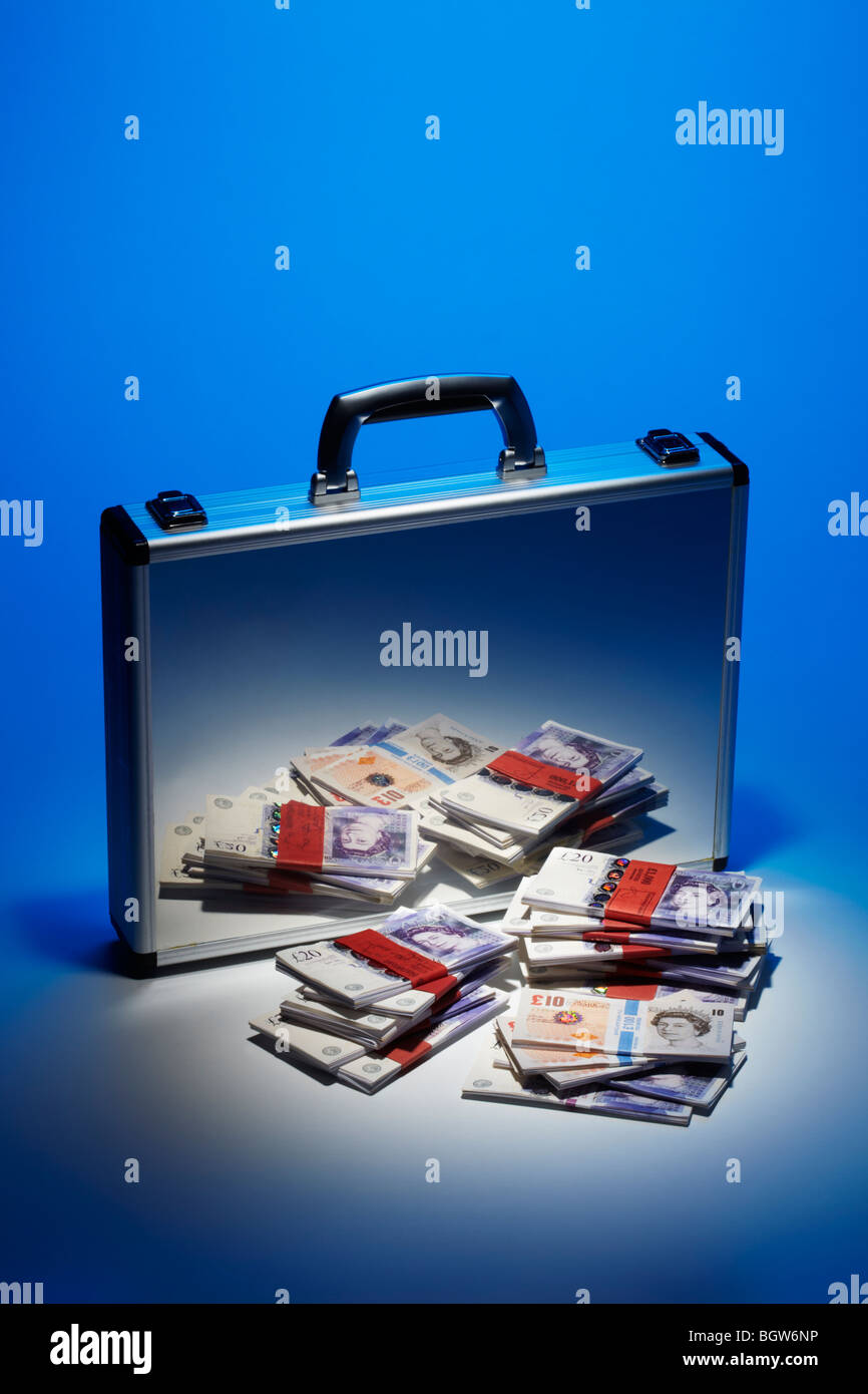 Bank Notes Stacked Reflected in Silver Brief Case Stock Photo