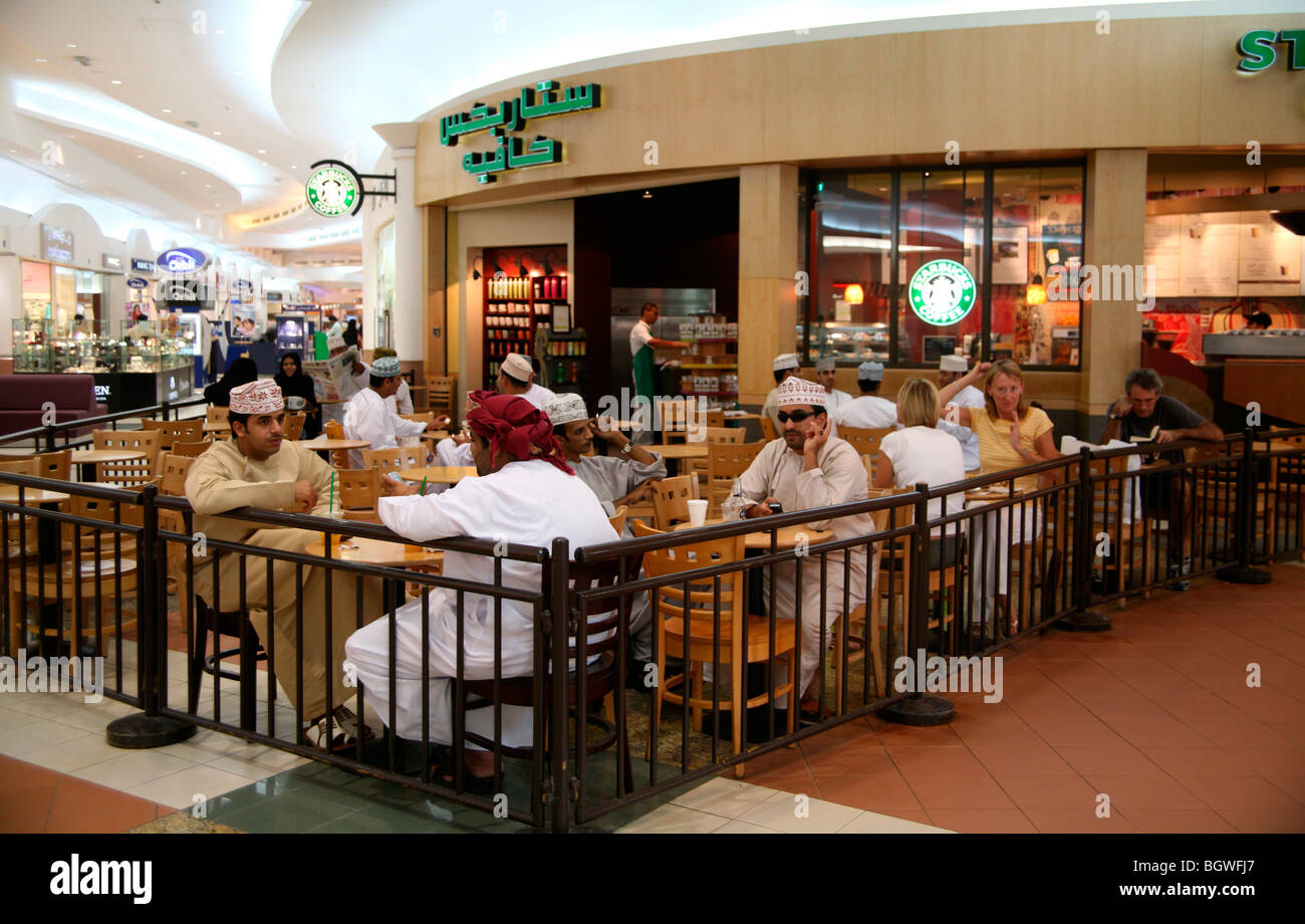 Starbucks coffeehouse with Omani men in Muscat Oman Stock Photo Alamy