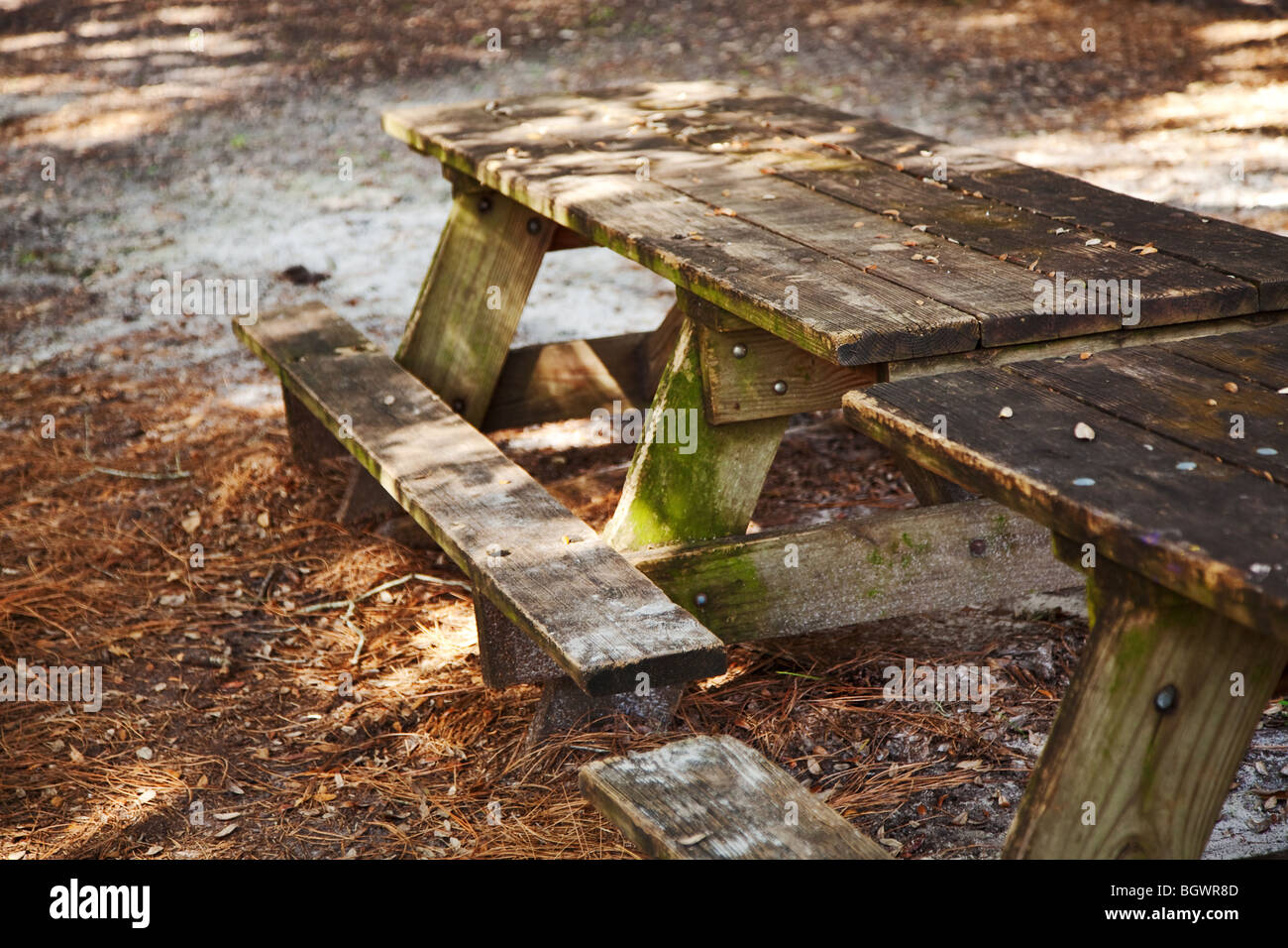 old wooden picnic table on a diagonal angle Stock Photo