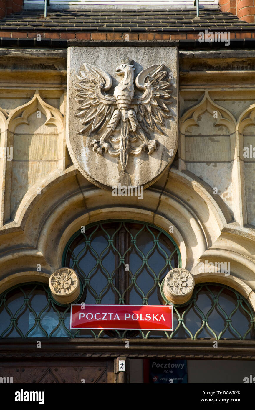 Polish Eagle coat of arms carved in stone, above the entrance door of the Post Office in the Polish town of Gliwice, Poland. Stock Photo