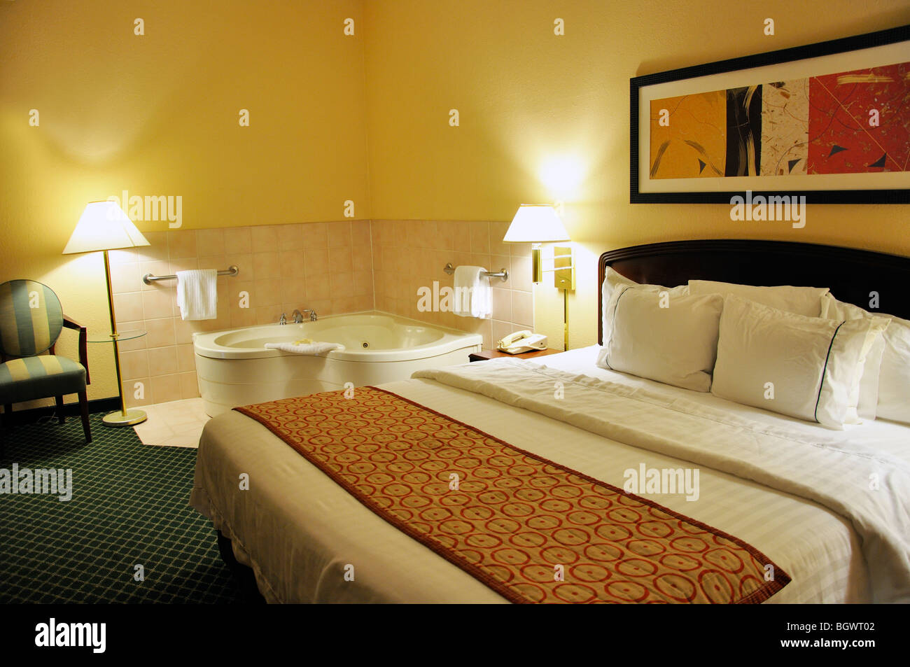 Hotel room bed marriott jacuzzi whirlpool hot bath tub hires stock