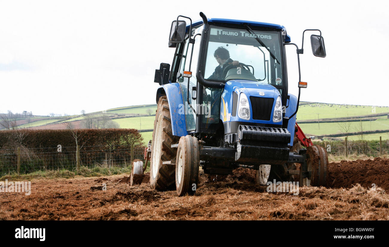 Tractor in a field Stock Photo - Alamy