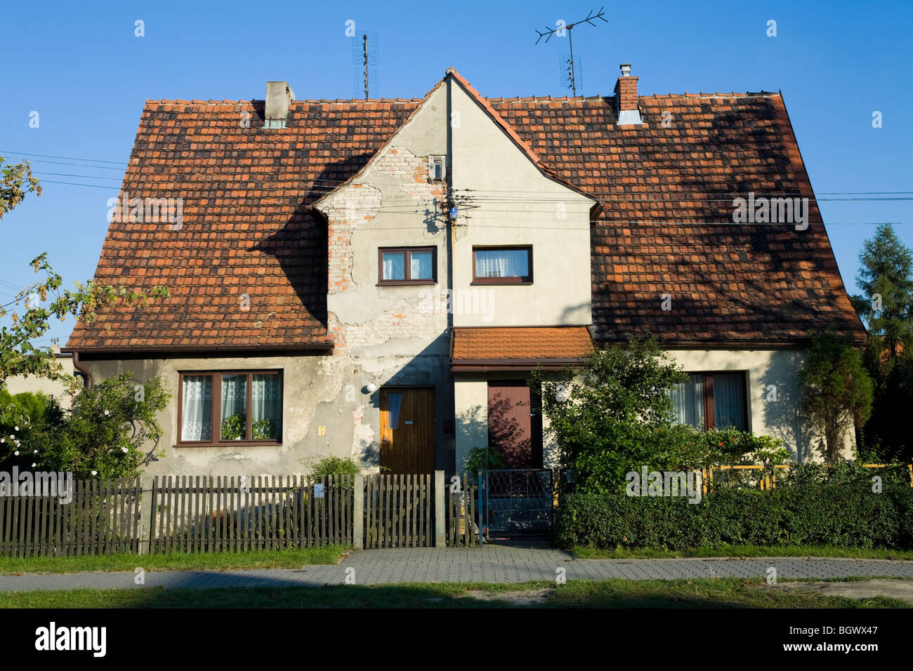 Semi detached houses which have been maintained differently. Stock Photo
