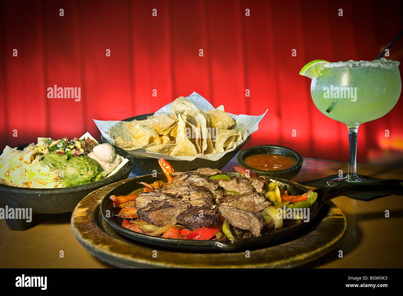 Mexican food and margarita, corn chips guacamole fajitas Stock Photo
