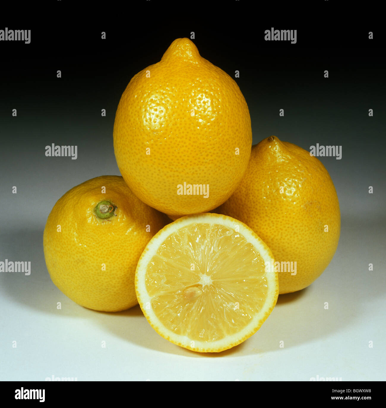 Group of lemon fruit, whole and sectioned, variety Eureka, origin South Africa Stock Photo