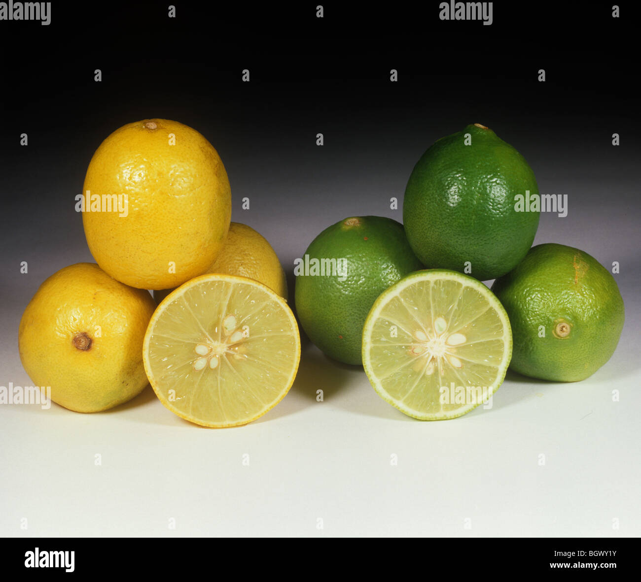 Whole & sectioned lime fruit variety West Indian Yellow comparison Stock Photo