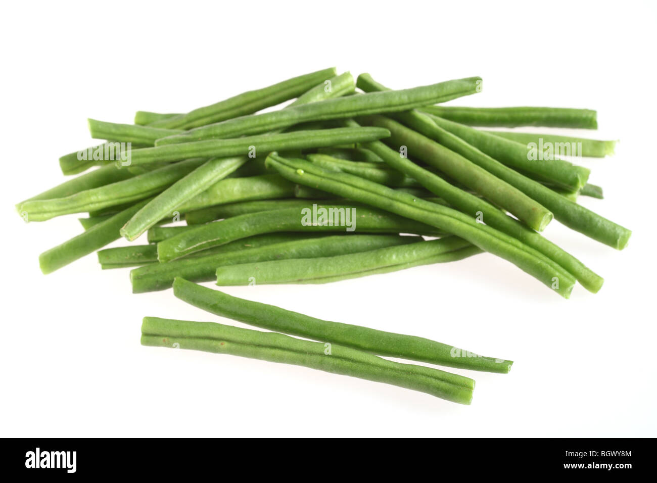 A heap of tender green haricot beans over a white background Stock Photo