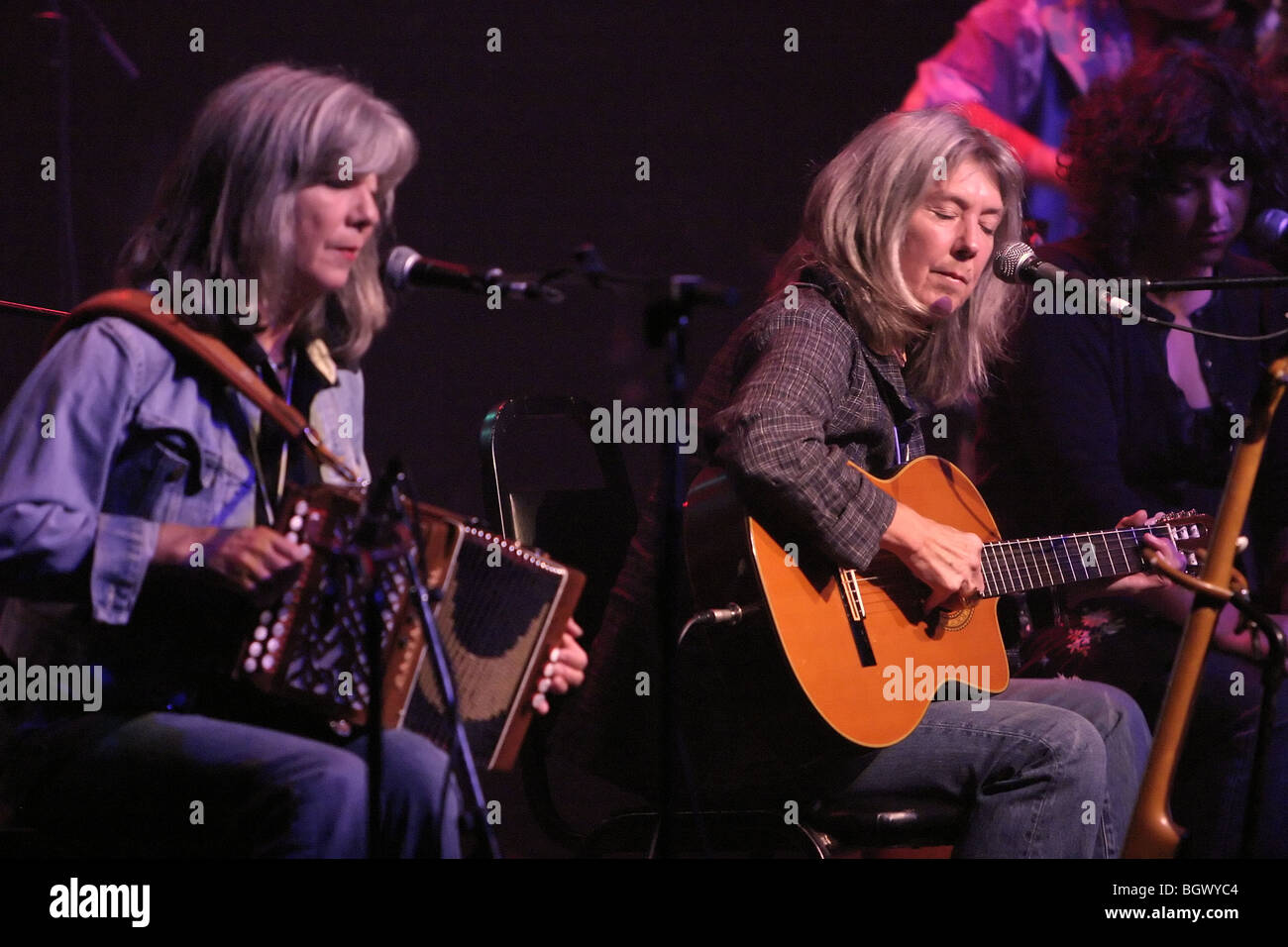 Kate (right) and her sister Anna McGarrigle in concert in Montreal in 2004. Stock Photo