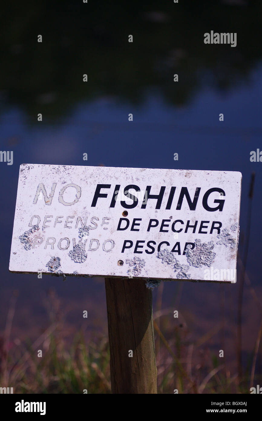 NO FISHING SIGN IN ENGLISH AND SPANISH MULTICULTURAL FISHING Stock