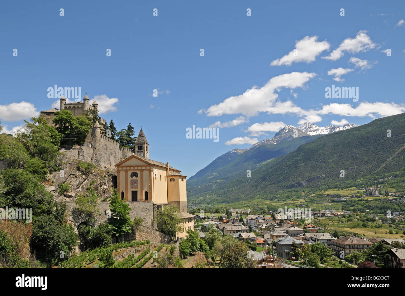 Saint St Pierre Castle Castello Parish Church and square bell tower 4 km west of Aosta Italy with alpine mountains in background Stock Photo