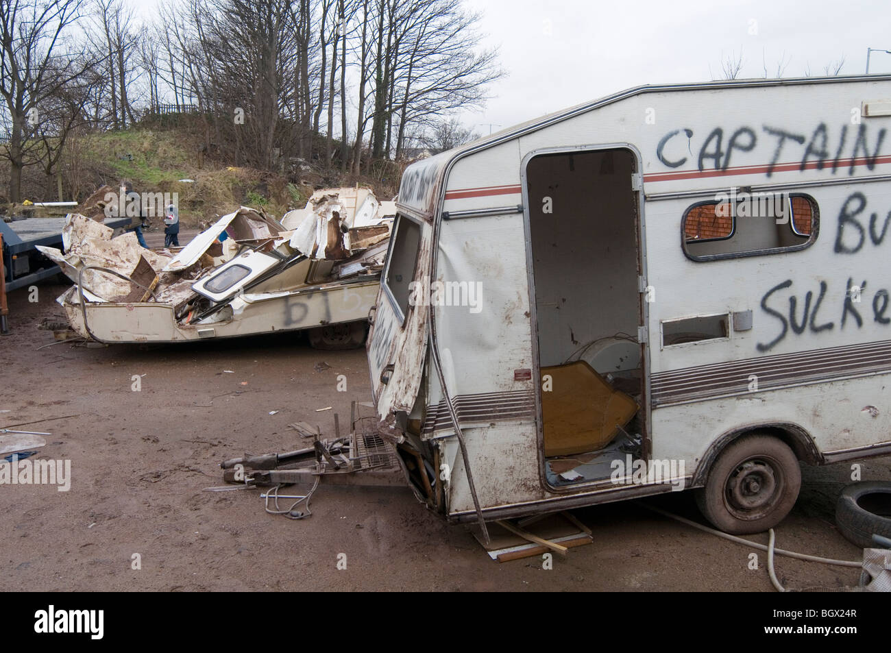 caravan caravans smashed up old vans camping camper campervans camp site  sites campsite campsite rubbish bad tip tips pit pits c Stock Photo - Alamy