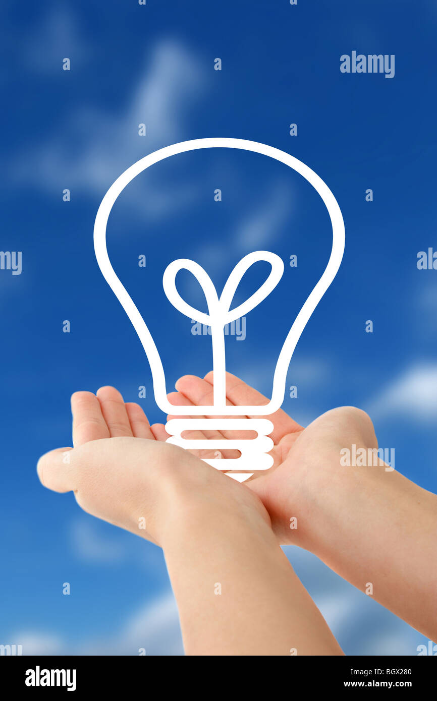 Human hands holding a stylized bulb in front of a bright blue sky Stock ...
