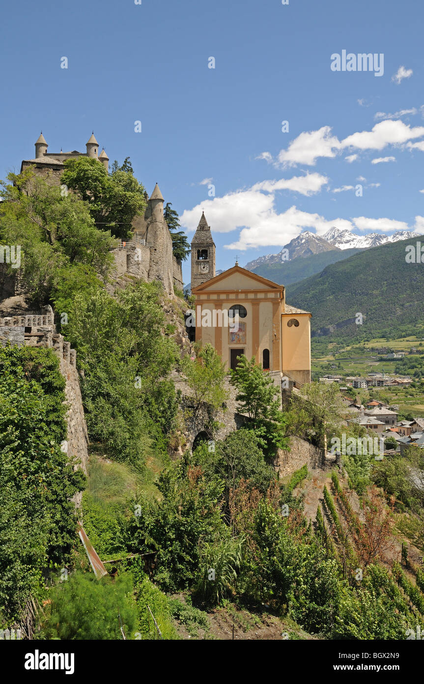 Saint St Pierre Castle Castello Parish Church and square bell tower 4 km west of Aosta Italy with alpine mountains in background Stock Photo