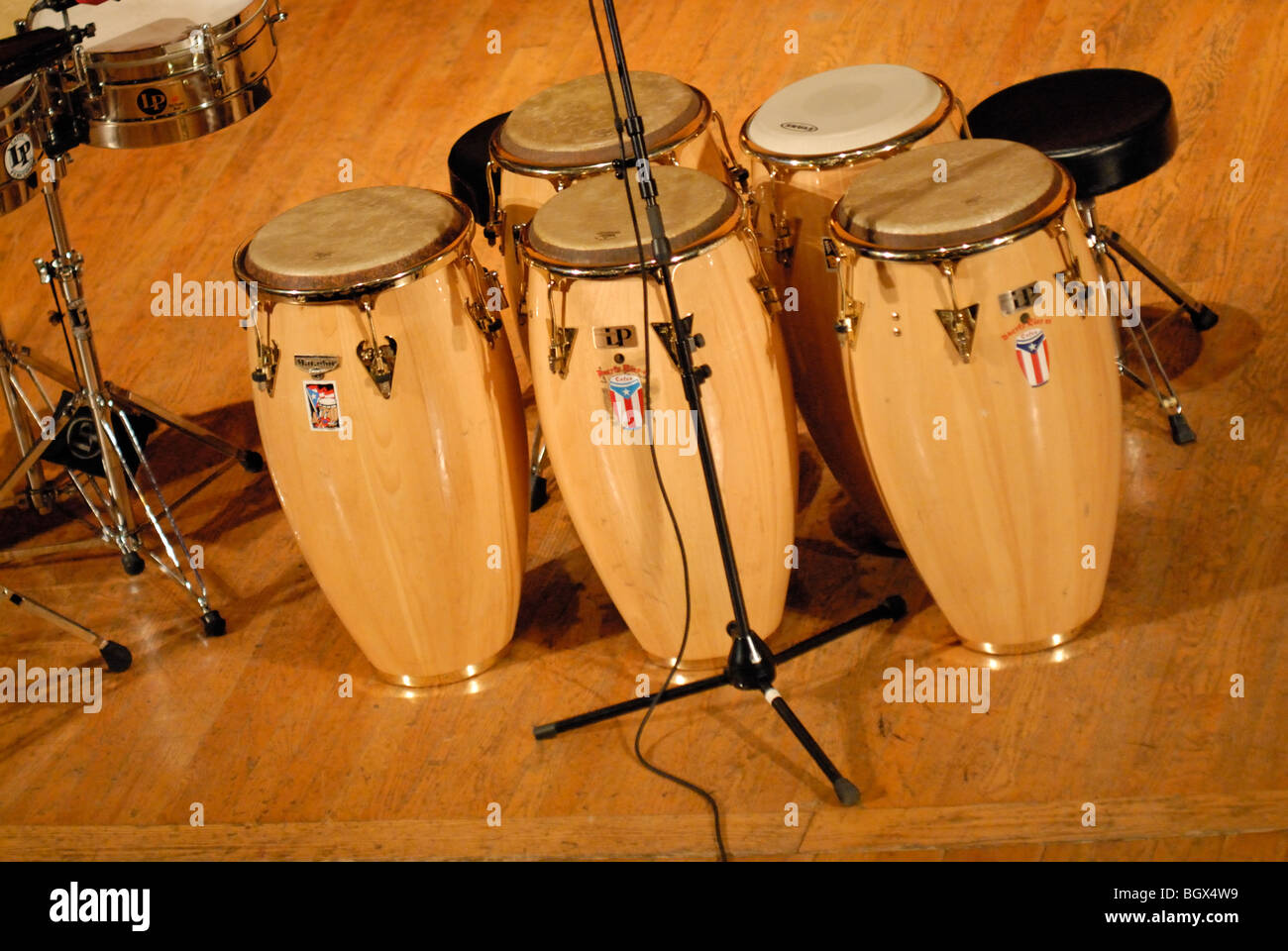 A set of conga drums, set up on a stage. Stock Photo