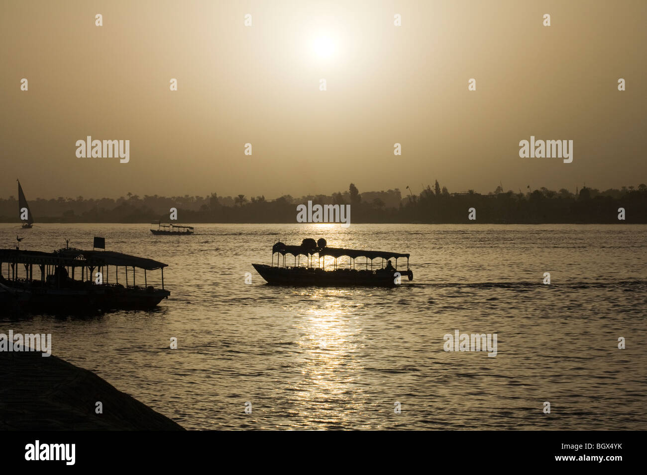 Motor launches on the River Nile at sunset, Luxor, Egypt, North Africa Stock Photo
