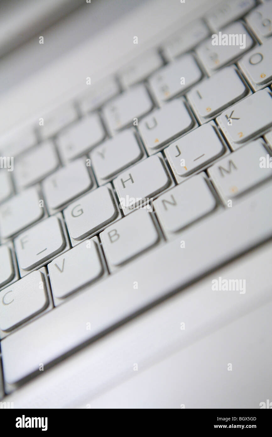 Very close shot of a white laptop keyboard showing letters Stock Photo