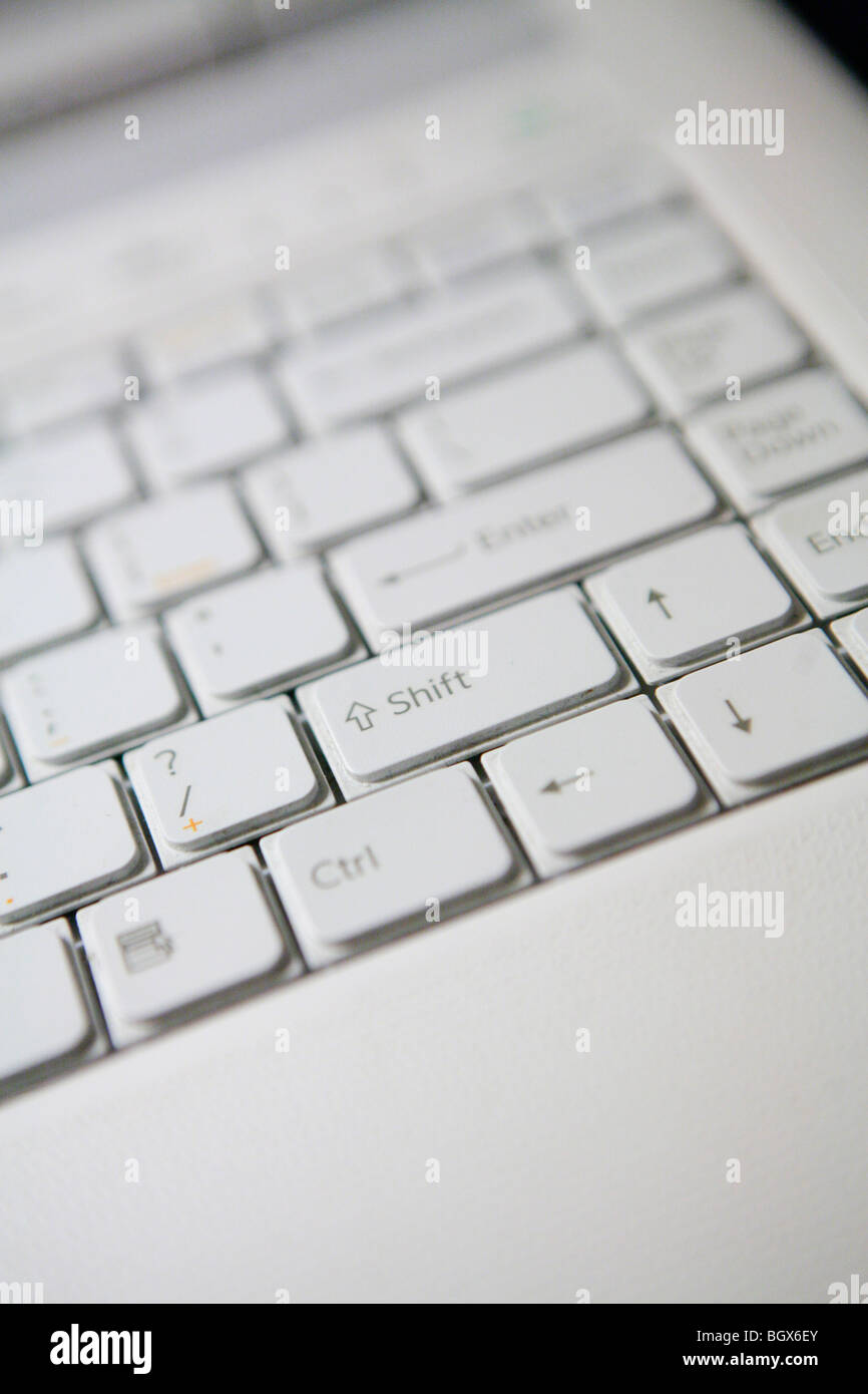 Very close shot of a white laptop keyboard showing letters Stock Photo