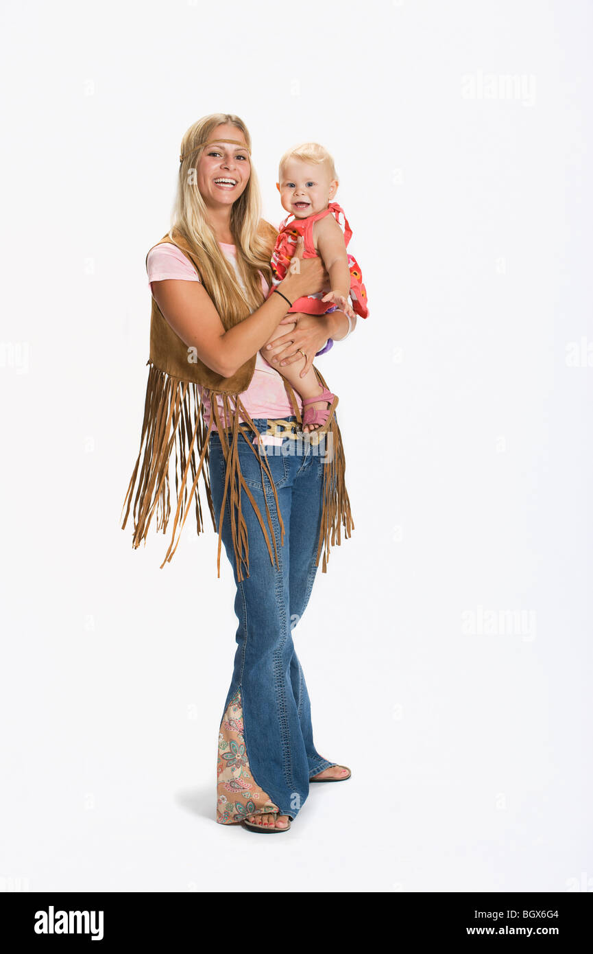 Woman and baby dressed in 1970's clothes Stock Photo