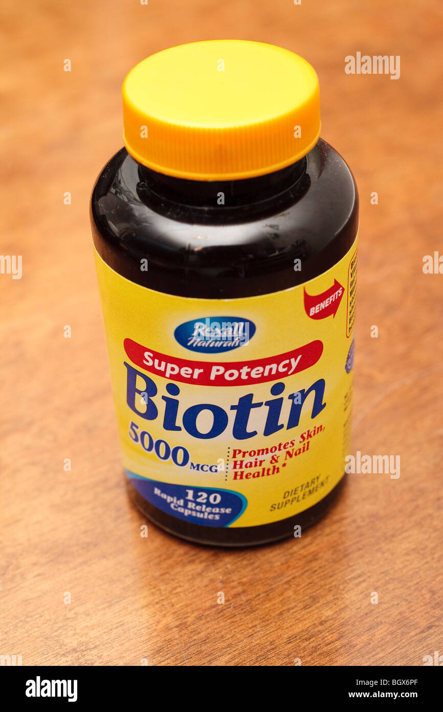 A Bottle of Biotin Supplement Stock Photo